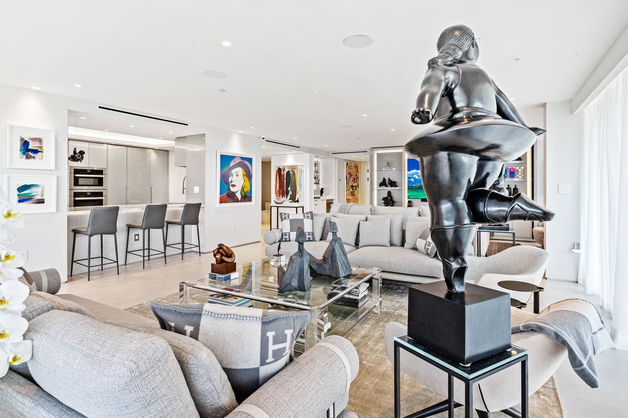 Open-plan living and dining with curated art collection