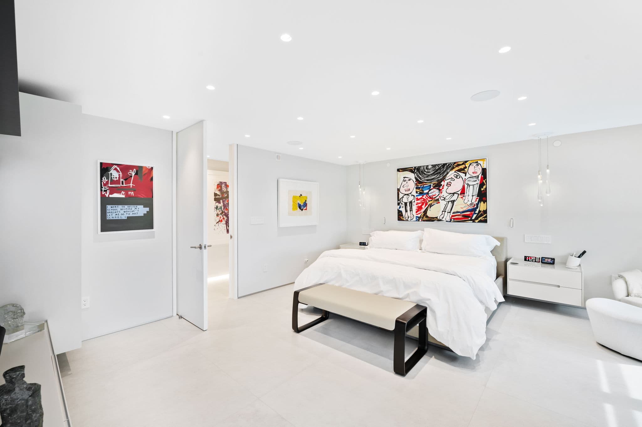 Elegant primary bedroom suite showcasing Aquamarine Green's signature blend of modern minimalism and coastal luxury